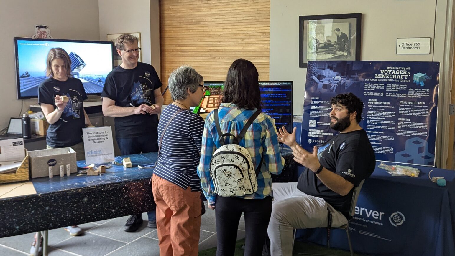 AI at Physics Fair IDIES team members explain how AI works through video games at the phyisics far.